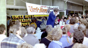 3AW's outside broadcasts always draw a crowd. Listeners gather for an auction of items from Uncle Roy's Nostalgia Boutique.